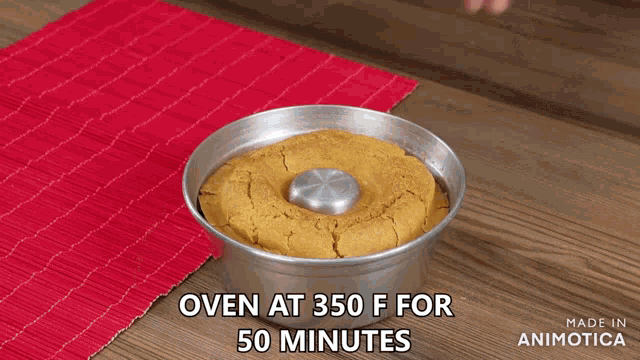 a person is putting a cake in the oven at 350 degrees