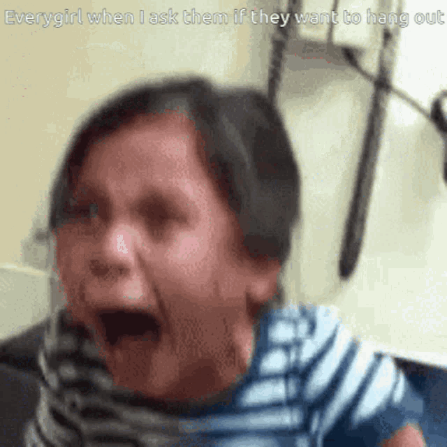 a girl is crying with her mouth open and the caption everygirl when i ask them if they want to hang out