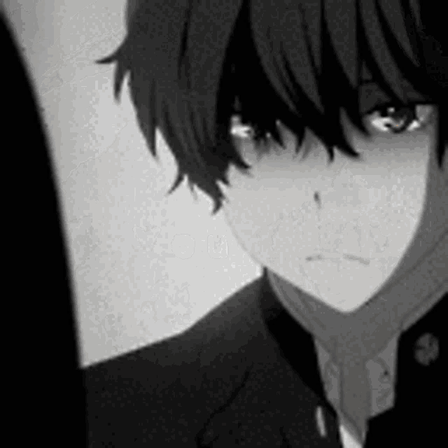 a boy with green eyes is wearing a suit and tie