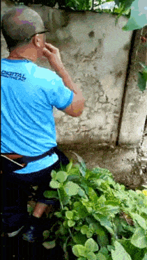 a man wearing a blue digital printing shirt
