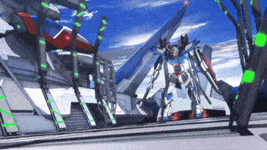 a robot is standing in front of a building that says ' tf ' on it