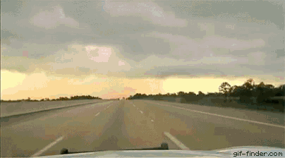 a view of a highway from a car with gif-finder.com written below it