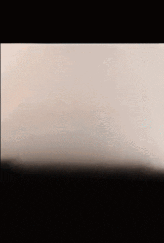 a piece of paper with a black background and a few white spots