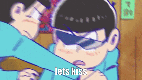 a cartoon character is hugging another cartoon character with the words `` lets kiss '' written on it .