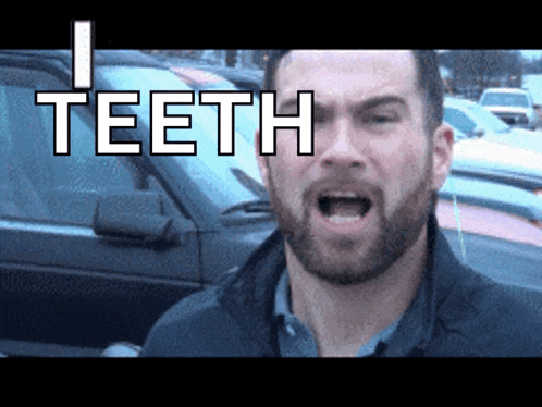 a man with a beard is making a funny face in front of a car with the word teeth above him