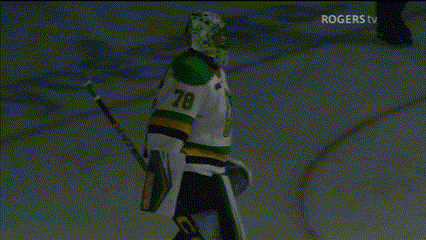 a hockey player wearing number 51 is hugging another player on the ice