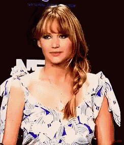a woman wearing a blue and white striped dress with a braid