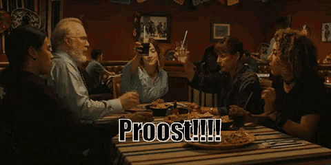 a group of people toasting at a table with the word proost written on the bottom