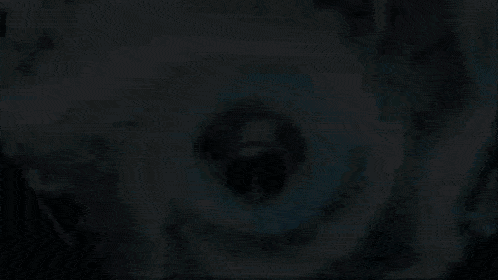 a close up of a jet engine with smoke coming out of it