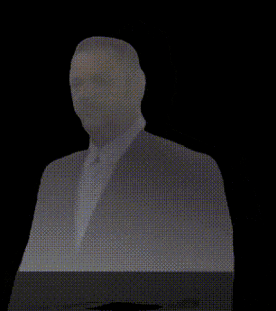a shadow of a man in a suit and tie
