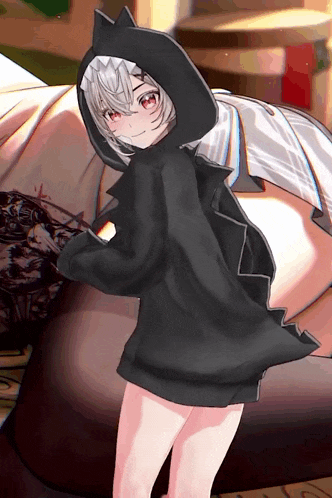 a girl with white hair and red eyes wearing a black hoodie with cat ears