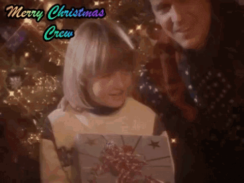 a merry christmas crew greeting with a man and woman