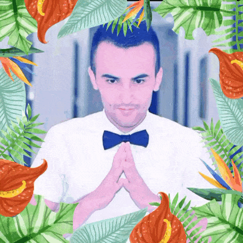 a man wearing a bow tie is surrounded by tropical flowers and leaves