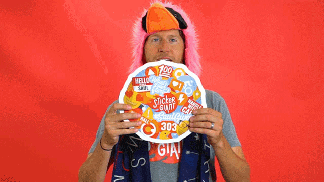a man wearing a flamingo hat and a shirt that says tickle