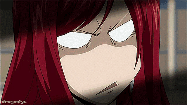 a girl with red hair is making a funny face with dragonlys written on the bottom