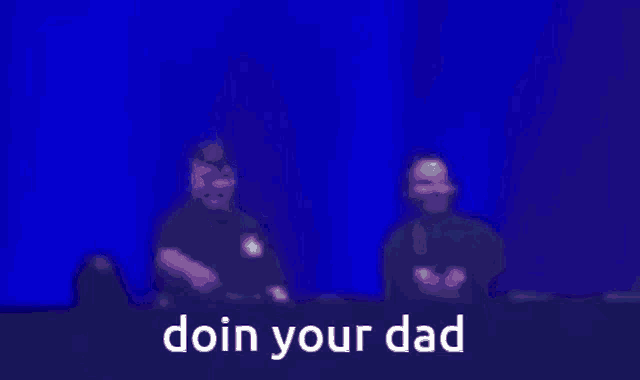 a blurry picture of two men with the words doin your dad written on the bottom
