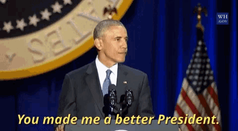 barack obama giving a speech with the words you made me a better president behind him