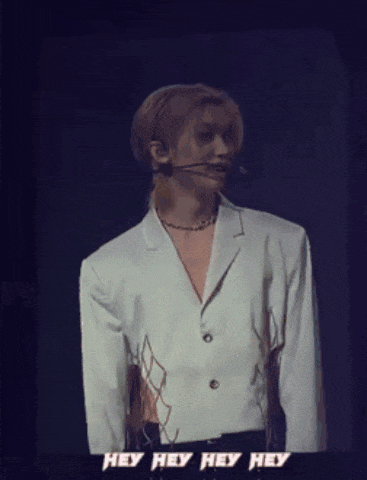 a man in a white jacket with the words hey hey hey on the bottom
