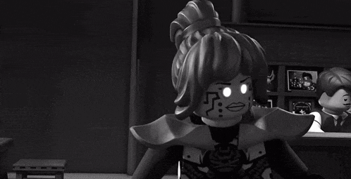 a black and white photo of a cartoon character holding a box