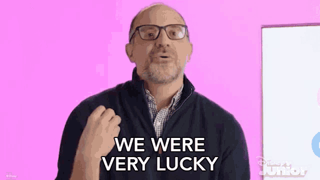a man with glasses and a beard is giving a thumbs up and saying `` we were very lucky '' .