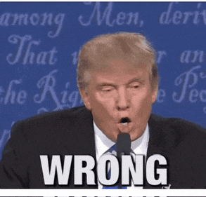 donald trump speaking into a microphone with the word wrong on the bottom right
