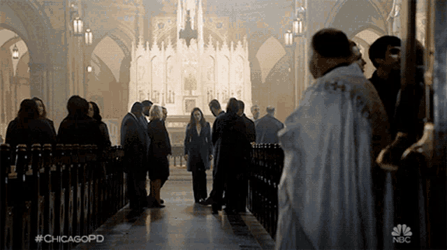 a group of people are gathered in a church with #chicagopd on the bottom