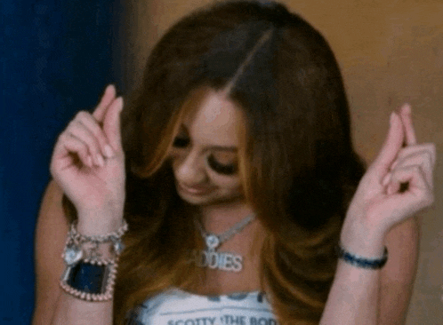 a woman with a necklace that says scotty the body