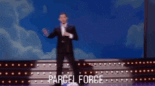 a man in a suit is standing on a stage with the words parcel force written on the bottom