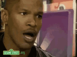 a close up of a man 's face with sesame street.org written on the bottom