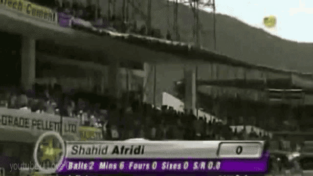 a purple and white sign with shahid atfridi written on it