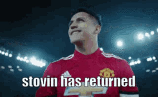 a soccer player wearing a red jersey with the words stovin has returned on it