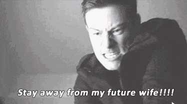 a black and white photo of a man with the words `` stay away from my future wife !!! ''