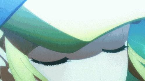 a close up of a girl with her eyes closed