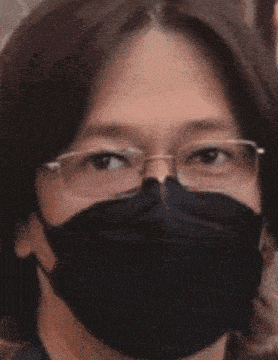 a man wearing glasses and a black mask says i love it