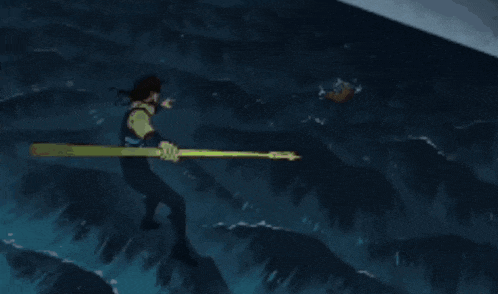 a man in a wet suit is holding a gold trident