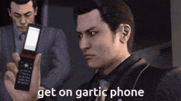 a man in a suit is holding a cell phone with the words get on gartic phone above him