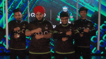 a group of men standing in front of a screen that says " iq "