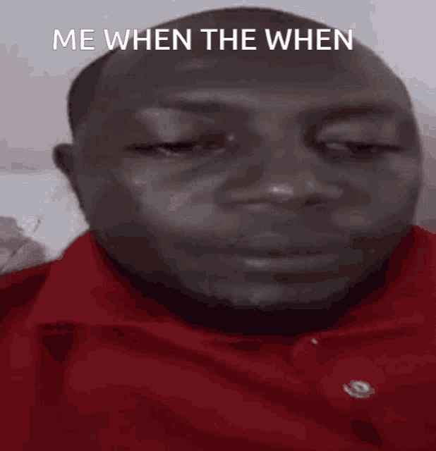 a man in a red shirt is smiling with the words " me when the when " above him