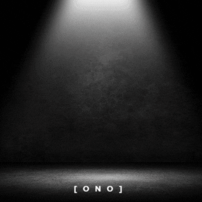 a spotlight is shining on a black wall and floor .