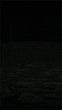 a green swirl in the dark with a white circle in the middle