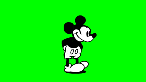mickey mouse is walking on a green screen in a cartoon .