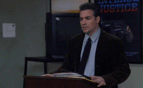 a man stands behind a podium with the words that was brilliant behind him