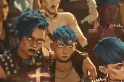 a group of people with blue hair are standing next to each other in a room .