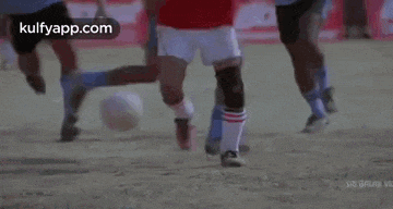 a group of men are playing soccer on a field .