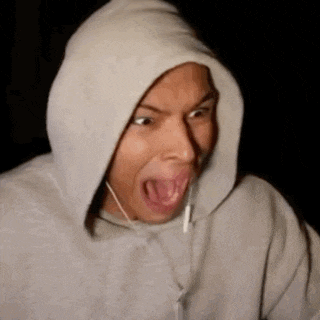 a man wearing a hoodie with his mouth open