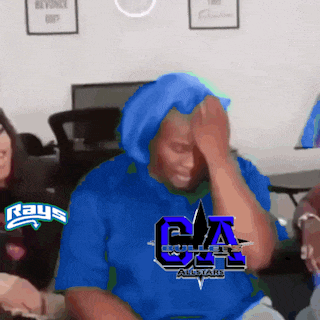 a man wearing a blue shirt that says bullets all stars