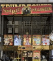 a store front with a red sign that says spirit halloween