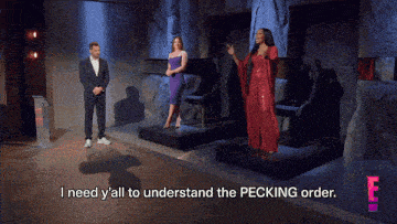 a man and two women on a stage with the words i need y'all to understand the pecking order on the bottom