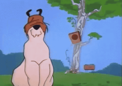 a cartoon dog with a hat on his head is sitting in front of a tree .