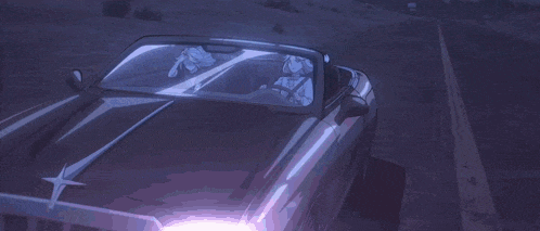 a girl with white hair is sitting in a car with another girl